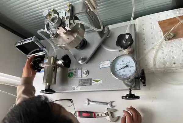 Industrial vacuum gauge being read by a process technician