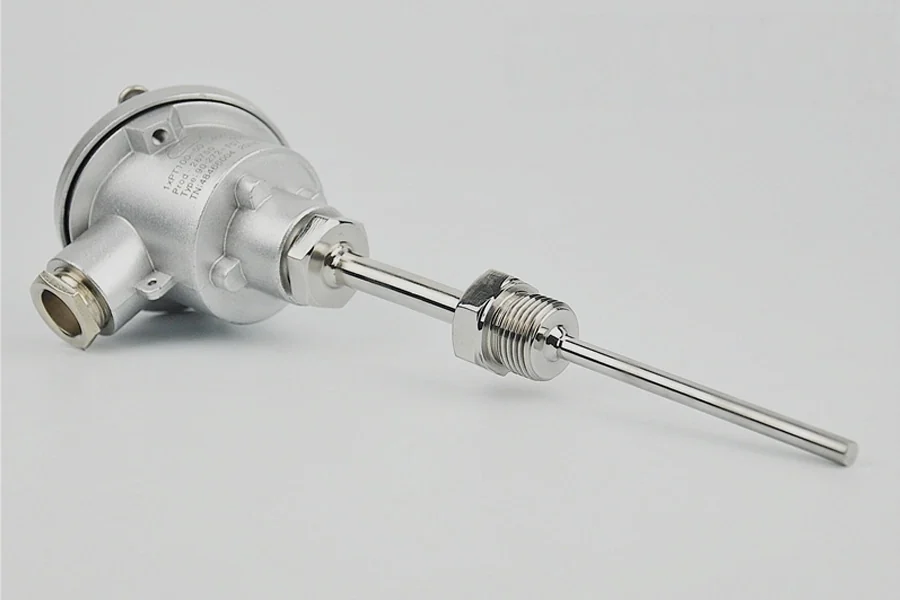 Assembled Type E thermocouple with stainless terminal head, thermowell, and threaded process connection