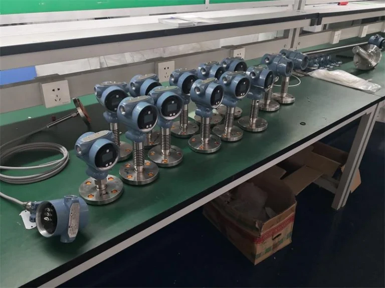 Pressure transmitter under test on the bench, with the 4-20 mA output loop connected
